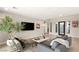 Tastefully decorated living room features modern furnishings and a large TV at 11943 Rockview Point St, Las Vegas, NV 89138