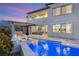 Inviting backyard pool with sleek lounge chairs and a covered patio, perfect for outdoor relaxation and entertaining at 11943 Rockview Point St, Las Vegas, NV 89138