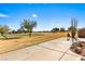 Expansive backyard with a patio overlooking a lush golf course and picturesque scenery at 1199 Golf Club, Laughlin, NV 89029