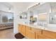 Bathroom boasts double sinks and leads to the bedroom, with natural light and access to a shower at 1199 Golf Club, Laughlin, NV 89029
