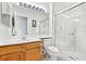 Well-lit bathroom with a glass-enclosed shower and wood vanity at 1199 Golf Club, Laughlin, NV 89029