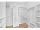 Walk-in closet with ample storage including shelves, rods, and built-in drawers at 1199 Golf Club, Laughlin, NV 89029