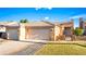 Inviting single-story home with a well-manicured lawn and a three-car garage at 1199 Golf Club, Laughlin, NV 89029