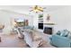Bright living room featuring a fireplace, built-in shelving, and comfortable seating area at 1199 Golf Club, Laughlin, NV 89029