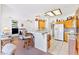 Open-concept living room and kitchen area with breakfast bar seating and fireplace at 1199 Golf Club, Laughlin, NV 89029
