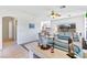 Open living space with tile flooring, large windows, and a view of the golf course at 1199 Golf Club, Laughlin, NV 89029