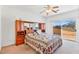 Sunlit main bedroom featuring built-in storage and sliding glass door to the patio at 1199 Golf Club, Laughlin, NV 89029