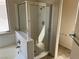 Bathroom featuring tiled shower and bathtub with glass doors and neutral walls at 1249 Lucia Dr, Las Vegas, NV 89128