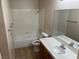 Neutral bathroom featuring tub, sink, toilet, mirror and tile floor at 1249 Lucia Dr, Las Vegas, NV 89128