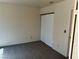 This bedroom includes neutral colored walls, carpet, and closet with sliding doors at 1249 Lucia Dr, Las Vegas, NV 89128