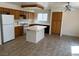 Bright eat-in kitchen with white tile countertops, stainless steel appliances, and tile floors at 1249 Lucia Dr, Las Vegas, NV 89128
