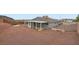 A large backyard, featuring low maintenance landscaping and a covered patio at 127 Mauve St, Henderson, NV 89012