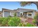 Charming home exterior with a well-maintained yard and mature landscaping at 127 Mauve St, Henderson, NV 89012