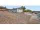 Home exterior featuring a two-car garage, concrete driveway, and low-maintenance rock landscaping at 127 Mauve St, Henderson, NV 89012