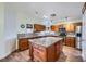 Spacious kitchen featuring a central island, granite countertops, and stainless steel appliances at 127 Mauve St, Henderson, NV 89012