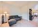 Cozy living room area with comfortable seating and tile flooring, open to dining area and kitchen at 127 Mauve St, Henderson, NV 89012