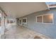 View of a large covered patio with concrete flooring and access to the backyard and a storage shed at 127 Mauve St, Henderson, NV 89012
