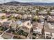 Panoramic aerial view shows the neighborhood with mountain views and the beautiful Nevada landscape at 1324 Spice Ridge Ct, Henderson, NV 89012