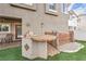 Outdoor kitchen area with built-in grill and countertops, great for entertaining at 1324 Spice Ridge Ct, Henderson, NV 89012