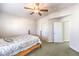 Well-lit bedroom featuring a ceiling fan, and carpet flooring at 1324 Spice Ridge Ct, Henderson, NV 89012