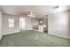 Spacious bonus room with carpet flooring, ceiling fan, and natural light from windows at 1324 Spice Ridge Ct, Henderson, NV 89012