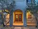Inviting front porch with a double door entrance and decorative windows, framed by desert landscaping at 1324 Spice Ridge Ct, Henderson, NV 89012