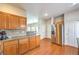 Spacious kitchen featuring a stainless steel refrigerator, wooden cabinets, and ample counter space at 1324 Spice Ridge Ct, Henderson, NV 89012
