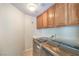 Functional laundry room equipped with washer, dryer, and built-in cabinets at 1324 Spice Ridge Ct, Henderson, NV 89012