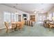 Open-concept living room and dining area with comfortable seating and natural light at 1324 Spice Ridge Ct, Henderson, NV 89012