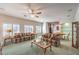 Bright living room with two sofas, a ceiling fan, and adjacent dining area at 1324 Spice Ridge Ct, Henderson, NV 89012
