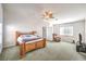 Spacious main bedroom features a ceiling fan, and natural light from dual windows at 1324 Spice Ridge Ct, Henderson, NV 89012
