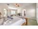 Main bedroom with ceiling fan, and view into Primary bath and walk-in closet at 1324 Spice Ridge Ct, Henderson, NV 89012