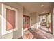 Charming covered porch with a double door entry and view of the neighborhood at 1324 Spice Ridge Ct, Henderson, NV 89012