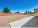 Expansive backyard with concrete patio, brick walls, and potential for personalized landscaping at 16 Goldleaf Falls Ave, North Las Vegas, NV 89031