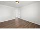 Bedroom with wood-look flooring, white walls, and an interior door at 16 Goldleaf Falls Ave, North Las Vegas, NV 89031