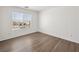 Simple bedroom with a window and wood-look floors at 16 Goldleaf Falls Ave, North Las Vegas, NV 89031