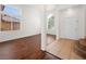 Inviting entryway with hardwood floors, staircase, and abundant natural light from large windows at 16 Goldleaf Falls Ave, North Las Vegas, NV 89031