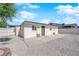 Backyard with concrete patio and rock landscaping, fully fenced with secure entry door at 1800 Atlantic St, Las Vegas, NV 89104
