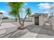 Backyard featuring a storage shed, tree and gravel landscaping at 1800 Atlantic St, Las Vegas, NV 89104