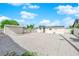 Large backyard with detached storage shed, rock landscaping, and secure fencing at 1800 Atlantic St, Las Vegas, NV 89104