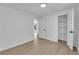 Room with neutral walls, wood-look floors, and open closet with shelves at 1800 Atlantic St, Las Vegas, NV 89104