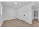 Bright room featuring neutral walls, wood-look floors, and a minimalist ceiling light at 1800 Atlantic St, Las Vegas, NV 89104
