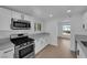 Stylish kitchen features new stainless steel appliances and white cabinets at 1800 Atlantic St, Las Vegas, NV 89104