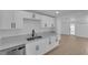 Modern kitchen features all white cabinets and stainless steel appliances at 1800 Atlantic St, Las Vegas, NV 89104