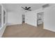 Spacious living room featuring light, wood-look flooring and ceiling fan at 1800 Atlantic St, Las Vegas, NV 89104