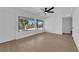 Bright living room with wood-look floors and large windows at 1800 Atlantic St, Las Vegas, NV 89104