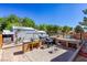 Spacious backyard with outdoor kitchen, bar seating, mature trees, and entertaining spaces at 208 W Alma St, Overton, NV 89040