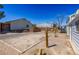 Backyard featuring gravel, brick bbq, fencing and multiple buildings at 208 W Alma St, Overton, NV 89040