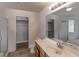 Bathroom includes a double vanity, toilet, walk-in closet, shower, and an adjoining tub at 208 W Alma St, Overton, NV 89040