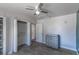 Bedroom featuring wood-look tile flooring, neutral walls and ceiling fan at 208 W Alma St, Overton, NV 89040